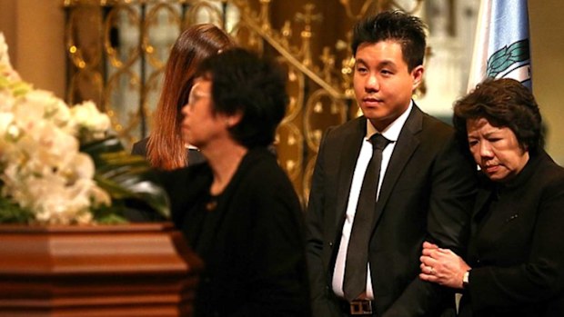 Alpha Cheng attends his father's funeral.