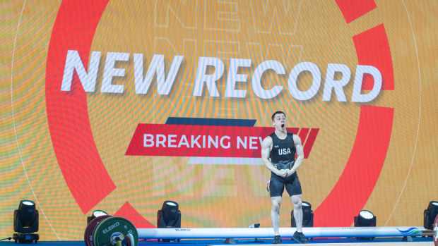 Hampton Morris celebrates after nailing his world record lift in the 61kg clean and jerk at the Weightlifting World Cup.