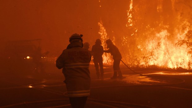 Firefighter a second after being hit by a car in thick smoke as fire roared through eastern Bilpin, December 21, 2019.