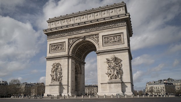 The Arc de Triomphe is deserted after French President Emmanuel Macron has declared a ban on all gathering of more than 100 people and the closure of all schools, restaurants, bars, cafes and clubs in response to the spread of the coronavirus.