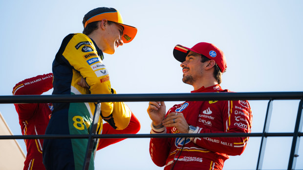 Oscar Piastri talking to pole sitter Charles Leclerc after qualifying for the Monaco Grand Prix.