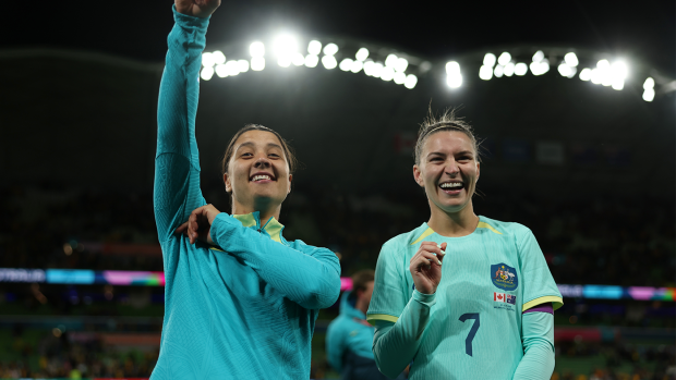 Sam Kerr and Steph Catley of Australia applaud fans after the team's 4-0 victory over Canada.
