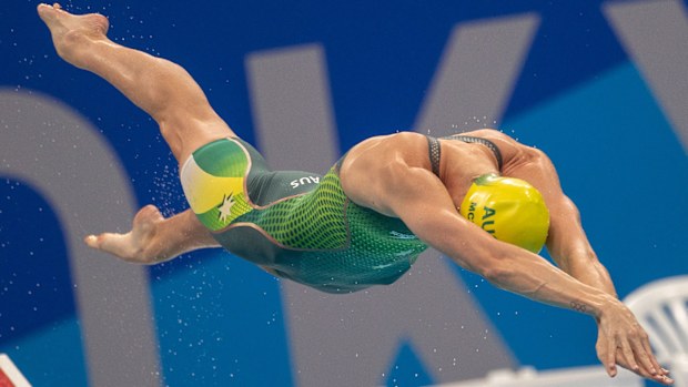 Emma McKeon launches into the pool at the Tokyo Olympic Games.