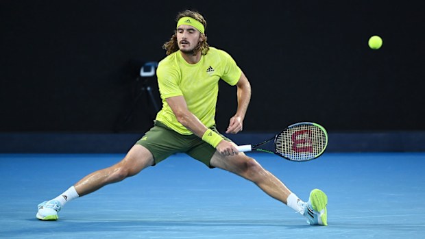 Stefanos Tsitsipas of Greece plays a forehand in his Men's Singles Semifinals match against Daniil Medvedev of Russia during day 12 of the 2021 Australian Open at Melbourne Park on February 19, 2021 in Melbourne, Australia