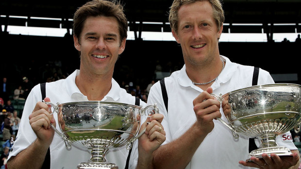 Todd Woodbridge (left) with Jonas Bjorkman after winning the 2004 Men's Doubles title at Wimbledon.