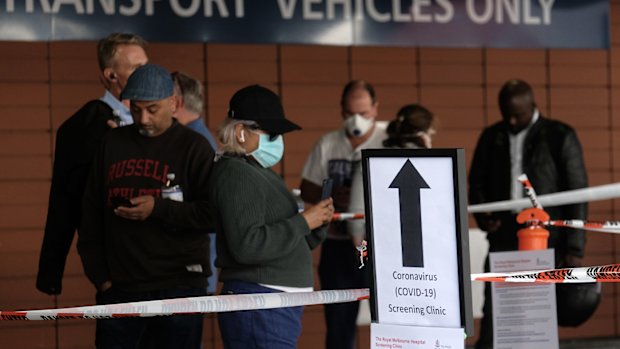 A sign explaining COVID-19 screening procedure is posted outside the Royal Melbourne Hospital on March 11, 2020 in Melbourne, Australia. (Photo by Luis Ascui/Getty Images)