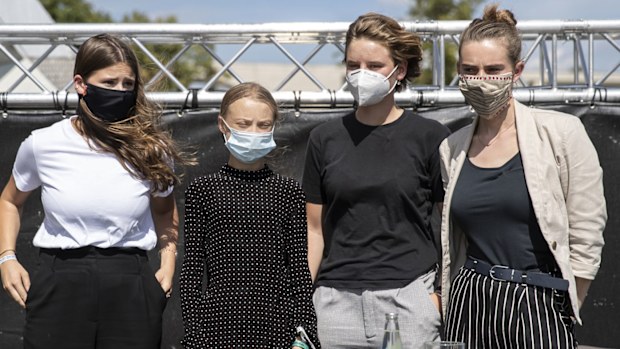  German climate activist Luisa Neubauer (L-R), Swedish climate activist Greta Thunberg, Belgian climate activist Anuna De Wever and Belgian climate activist Adelaide Charlier pose for a group picture after a press conference following the meeting with German Chancellor Angela Merkel on August 20, 2020 in Berlin, Germany