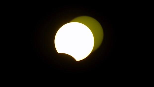 The solar eclipse is seen from Jiddah, Saudi Arabia.
