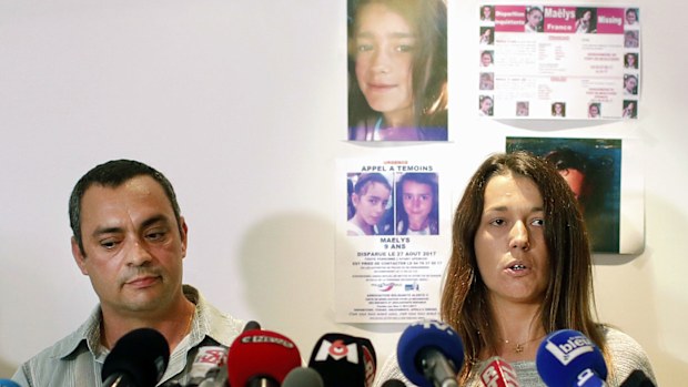 The father of a missing girl, Maelys, Joachim de Araujo, left, and his wife, Jennifer, hold a press conference in Lyon, central France. (AAP)