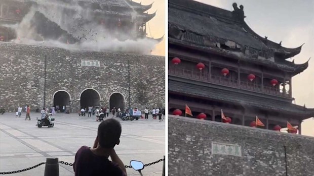 This screengrab taken from a video shows roof tiles collapsing from a centuries-old Chinese drum tower in Anhui, China, on May 19, 2025.