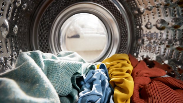 View Looking Out From Inside Washing Machine Filled With Laundry