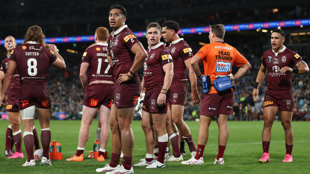Maroons players look on in dismay on after losing game three of the State of Origin series.