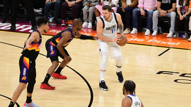 Chris Paul is seen guarding Luka Doncic during game seven