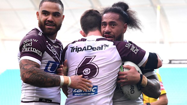 Manly celebrate against Titans