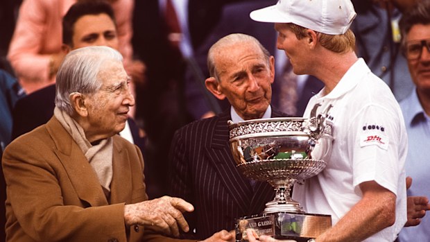 Jim Courier greets Rene Lacoste at the French Open