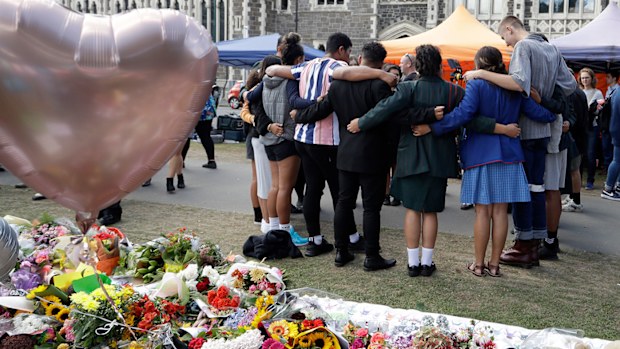 Students embrace at Botanical Gardens in Christchurch