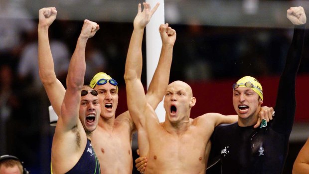 Euphoria erupts as the Australian men's relay team celebrates trumping the US.