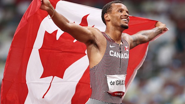 Andre De Grasse of Team Canada celebrates after winning the gold medal in the Men's 200m Final on day twelve of the Tokyo Olympic Games.