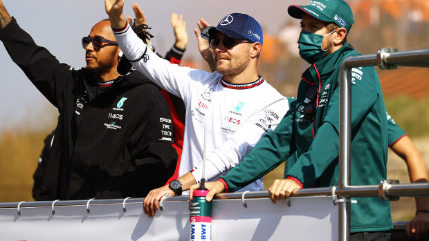 Valtteri Bottas (centre) with Lewis Hamilton and Sebastian Vettel.