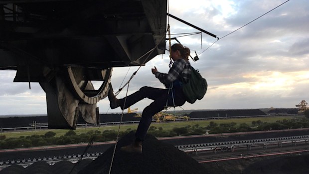 Two women have shut down Newcastle coal port, abseiling from coal handling machinery.  