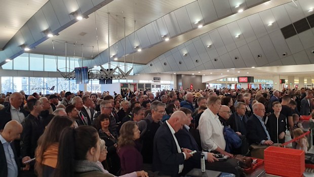 Melbourne Airport's Qantas Terminal has large queues following the evacuation. Picture:John Tomczyk‏