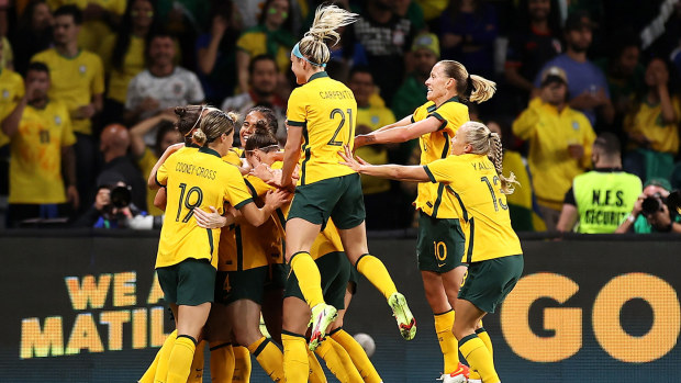 Clare Polkinghorne of the Matildas celebrates with her team mates after scoring a goal during the Women's International Friendly match between the Australia Matildas and Brazil 