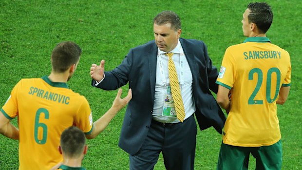 Socceroos coach Ange Postecoglou speaks with players.