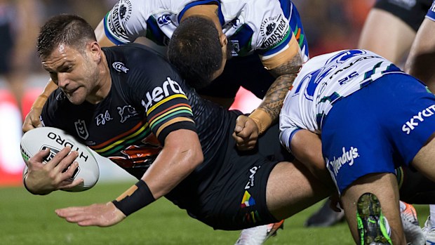 Panthers prop Tim Grant is tackled 
