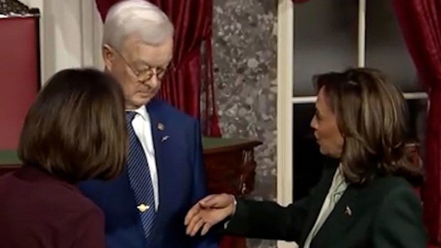 Bruce Fischer looked at Kamala Harris' hand but refused to shake it.