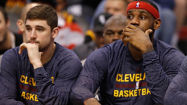 Harris beside LeBron James in Cleveland