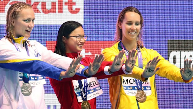 World swimming championships women's 100-butterfly gold medalist Margaret MacNeil (C) of Canada, silver medalist Sarah Sjoestroem (L) of Sweden and bronze medalist Emma McKeon of Australia