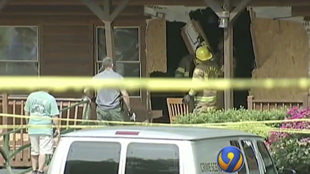 Photographs from the scene showed a shattered opening in a restaurant wall, where the car had smashed inside the building. (AP)