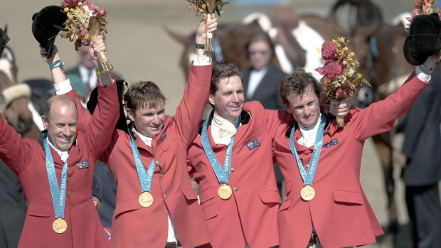 An Australian eventing team of Andrew Hoy, Matt Ryan, Phillip Dutton and Stuart Tinney celebrate winning gold at the Sydney 2000 Olympics.