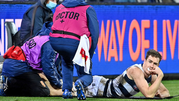 The doctors look at Jeremy Cameron of the Cats' hamstring