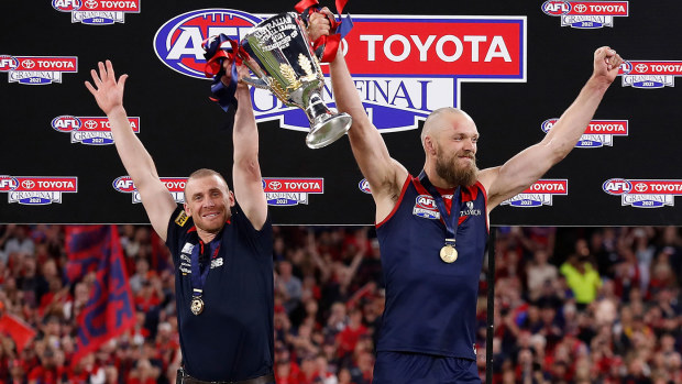Simon Goodwin, Senior Coach of the Demons and Max Gawn of the Demons hold the cup aloft during the 2021 Toyota AFL Grand Final match between the Melbourne Demons and the Western Bulldogs at Optus Stadium on September 25, 2021 in Perth, Australia. (Photo by Michael Willson/AFL Photos via Getty Images)
