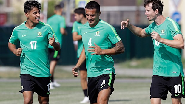Socceroos teammates Daniel Arzani, Tim Cahill, and Robbie Kruse