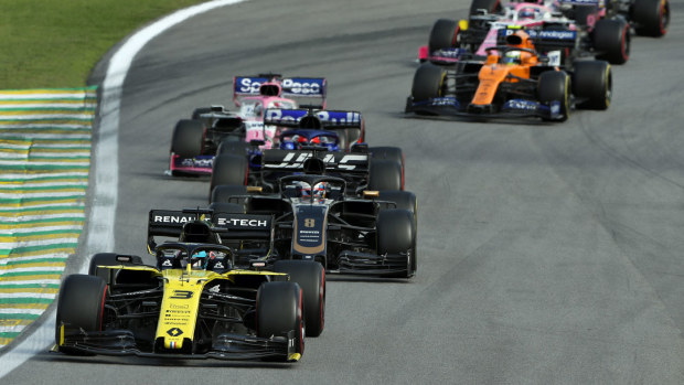 Daniel Ricciardo of Australia driving the (3) Renault Sport Formula One Team RS19 leads Romain Grosjean of France driving the (8) Haas F1 Team VF-19 Ferrari on track during the F1 Grand Prix of Brazil