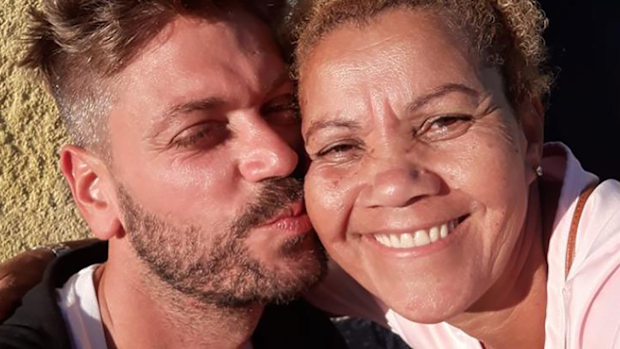 Hugo Stanley-Cary poses for a photograph with a resident he met in one of Rio's battle-scarred favelas. AAP Image/Supplied by Hugo Stanley-Cary
