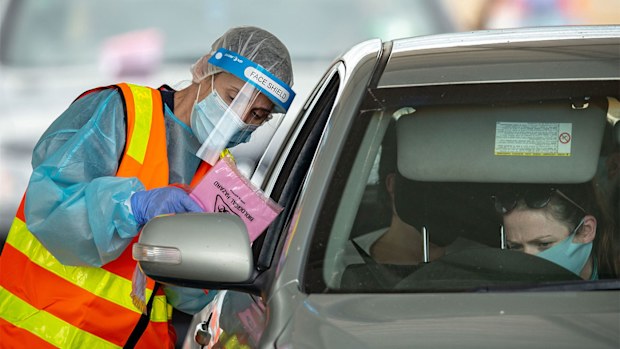 Medical professionals conduct COVID-19 tests at a drive through testing clinic in Shepparton.