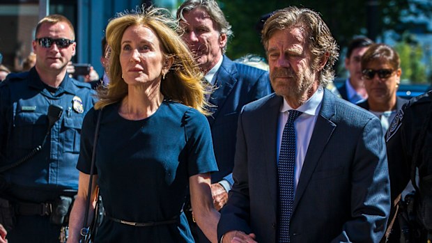 Felicity Huffman arrives with her husband William H. Macy at John Joseph Moakley US Courthouse in Boston on Sept. 13, 2019. She gets 14 days jail for her role in the college admissions scandal