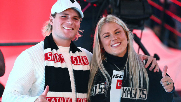 Jackson Warne and Brooke Warne pose before doing the coin toss 