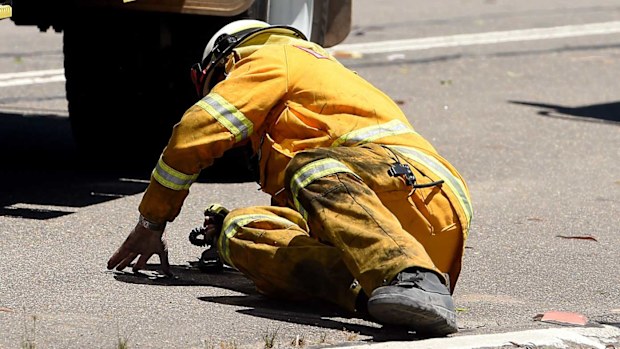 Tony Abbott coming a cropper after falling from a fire truck. (AAP)