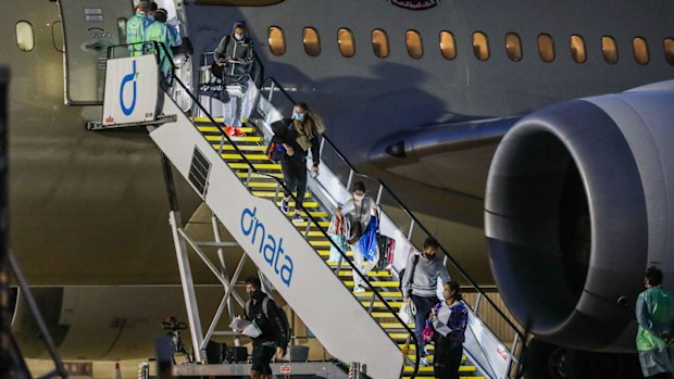Tennis players and their support teams are seen disembarking Flight EY460 carrying tennis players and their support teams participating at the Australian Open at Melbourne Jet Base adjoining the Melbourne International airport on January 14, 2021 in Melbourne, Australia
