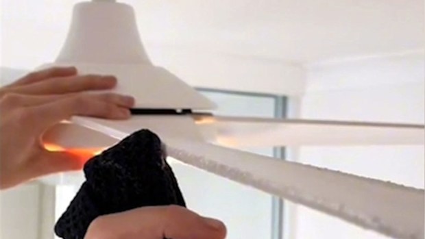 Dusting a ceiling fan