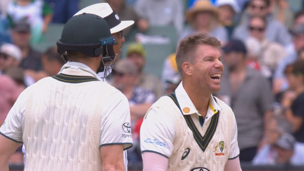 David Warner laughing when told third umpire Richard Illingworth was stuck in a lift, triggering a delay to the start of play.