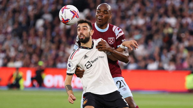 Bruno Fernandes of Manchester United is challenged by Angelo Ogbonna of West Ham.