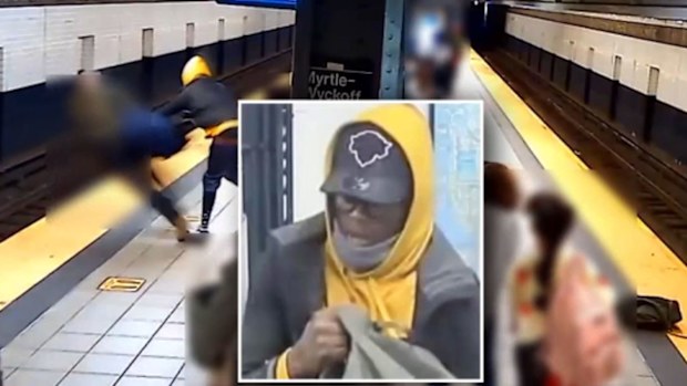 A man is shoved onto the subway tracks in New York.