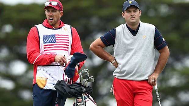 Patrick Reed's caddie reportedly punched a fan at the Presidents Cup.
