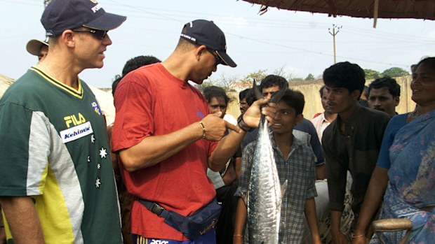 Matthew Hayden (left) and Andrew Symonds of Australia examine some local produce at the fish markets in Vizag, Indi