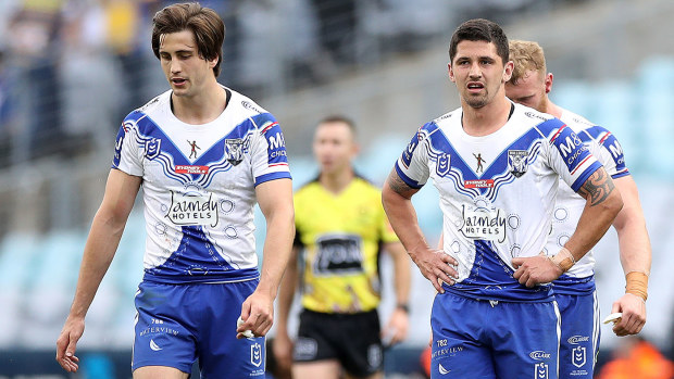 Bulldogs players leave the field after being beaten 18-16 by Parramatta.